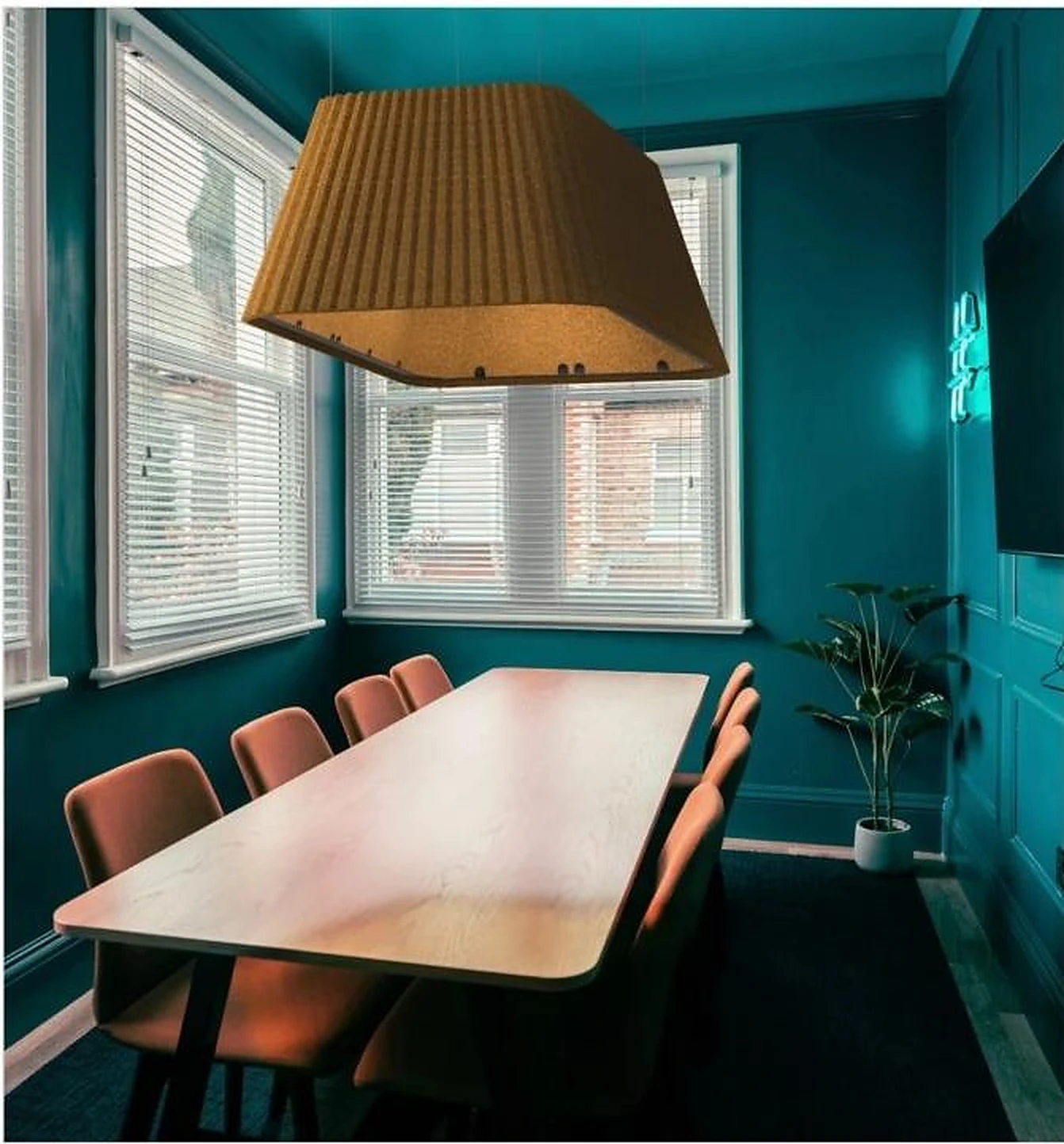 Large PET felt acoustic pendant centered above a meeting-room table